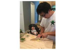 My son (Henry) watching my husband (Pete) prepare dinner for the family. 