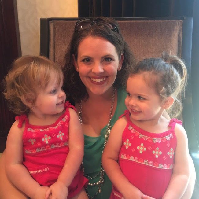 mom smiling with 2 little daughters, mom sobriety journey