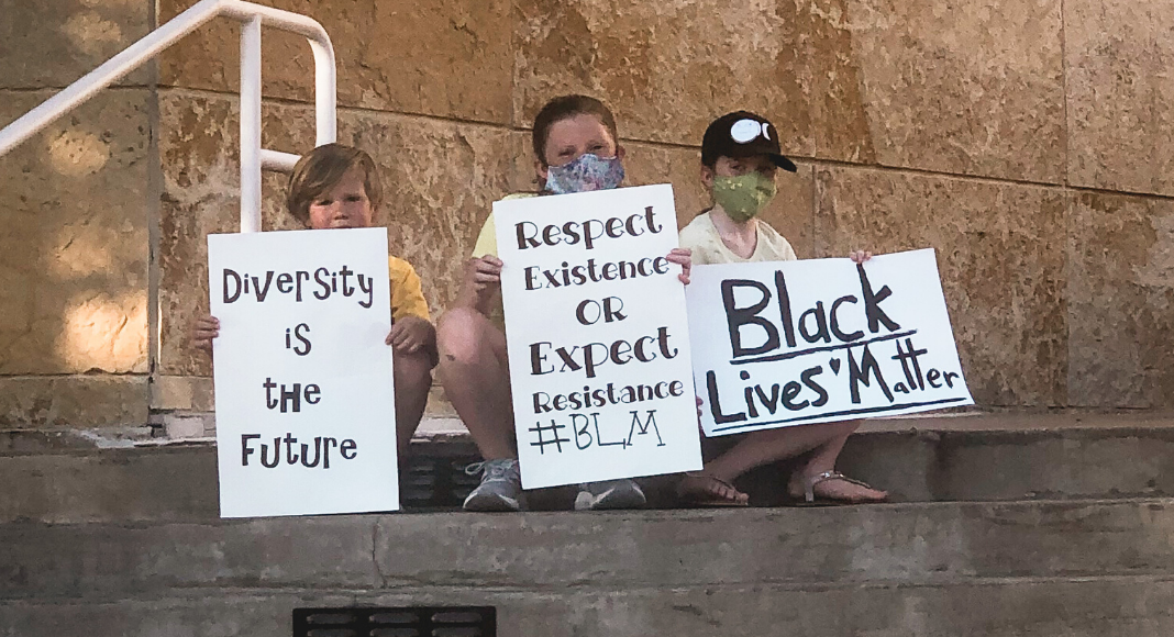 children with protest signs
