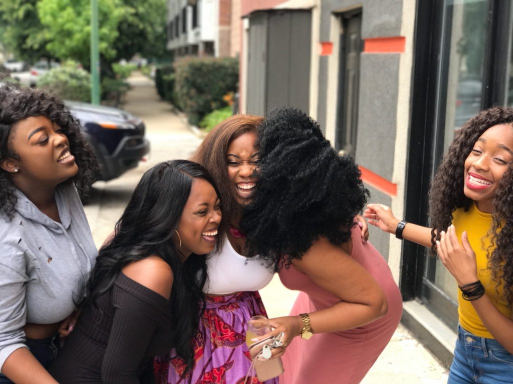 group of women friends laughing, how to make mom friends