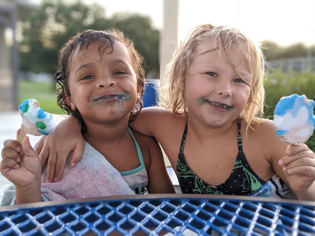 2 little girls smiling eating popsicles, summer photo prompts