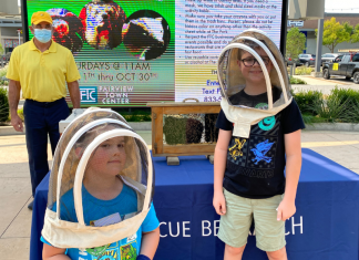 kids wearing beekeeping hats at Critter Club presentation