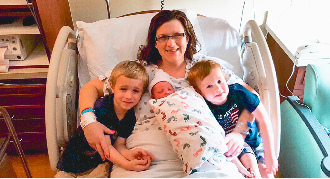 mom with newborn and children