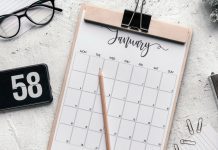 A January calendar on a clipboard.