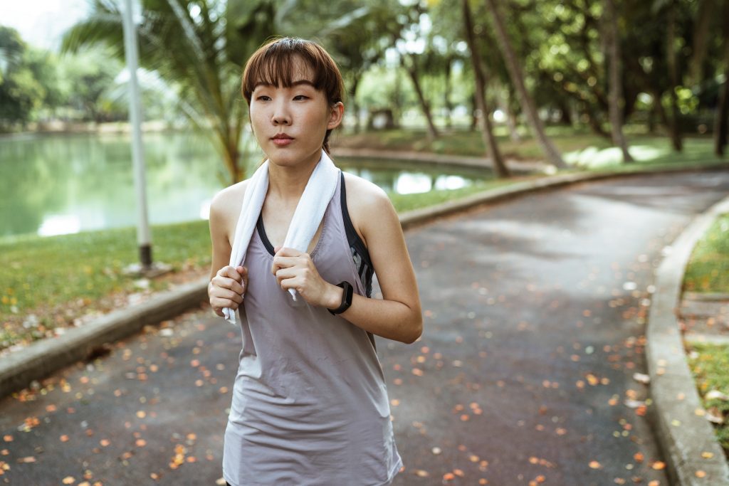 woman jogging at the park, self care ideas for moms