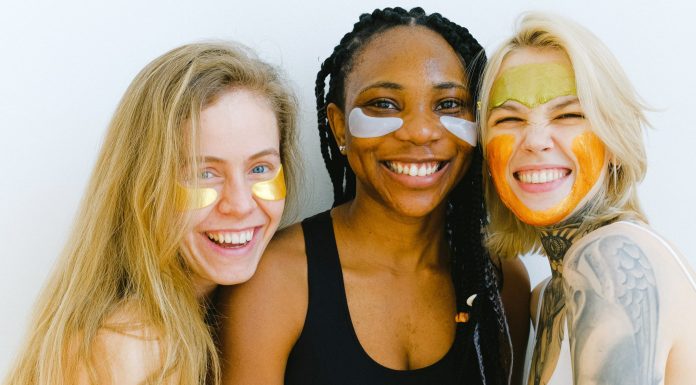 3 women smiling while doing eye masks, how to beat the winter blues