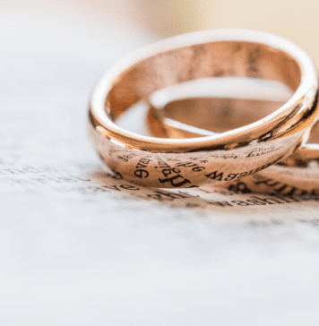 two gold wedding rings, hyphenating your married name