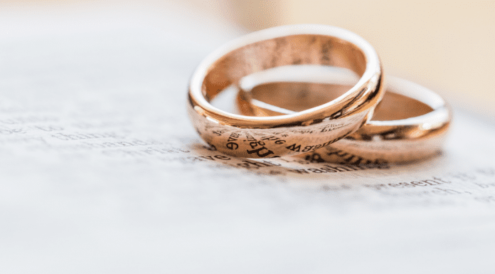 two gold wedding rings, hyphenating your married name