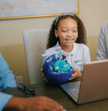 daughter in virtual school as parents look on, GREAT HEARTS ONLINE DFW HOMESCHOOL OPTIONS