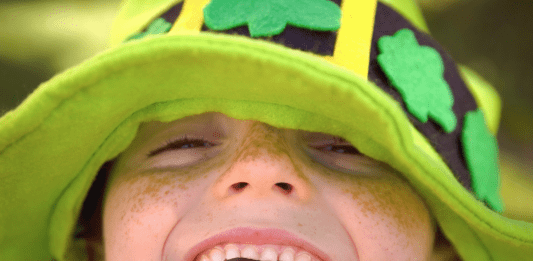 smiling child in a shamrock hat, St. Patrick's Day activities in McKinney
