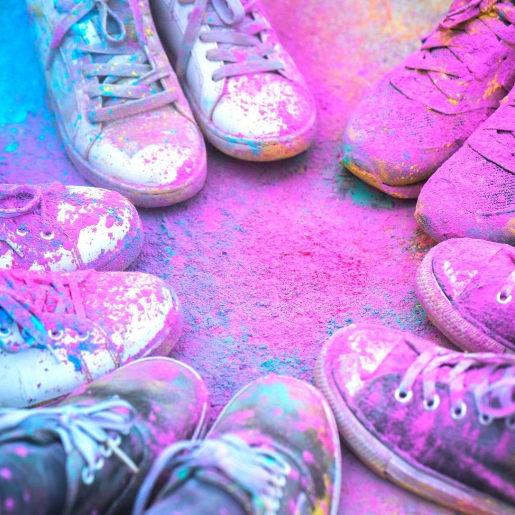 Holi activities with kids image of shoes covered in color