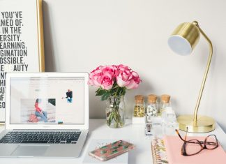 pretty desk with flowers and laptop, quit your job and change careers