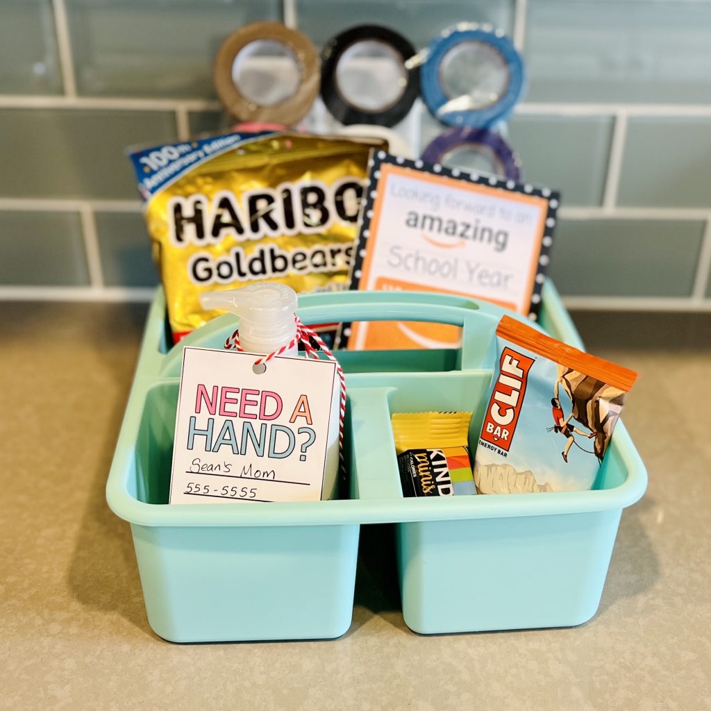 collection of teacher gifts in cute bin