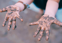 muddy kid hands