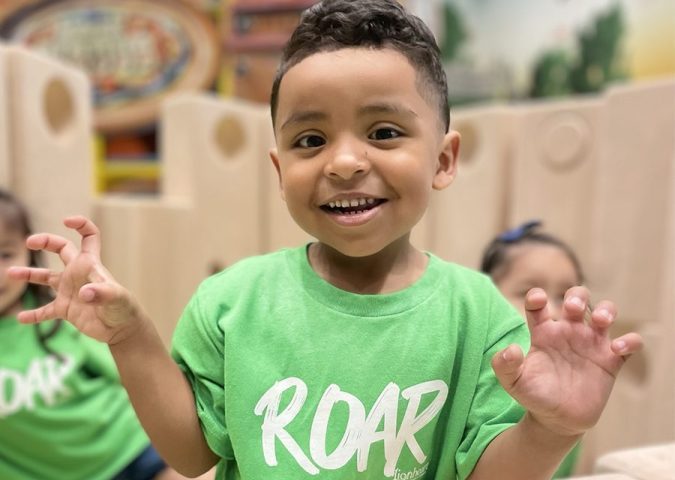 Smiling preschool boy at Lionheart Children's Academy.