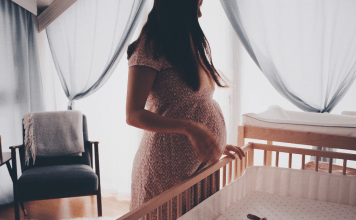 pregnant woman in nursery