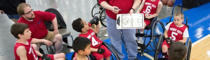a team of young basketball players in wheelchairs