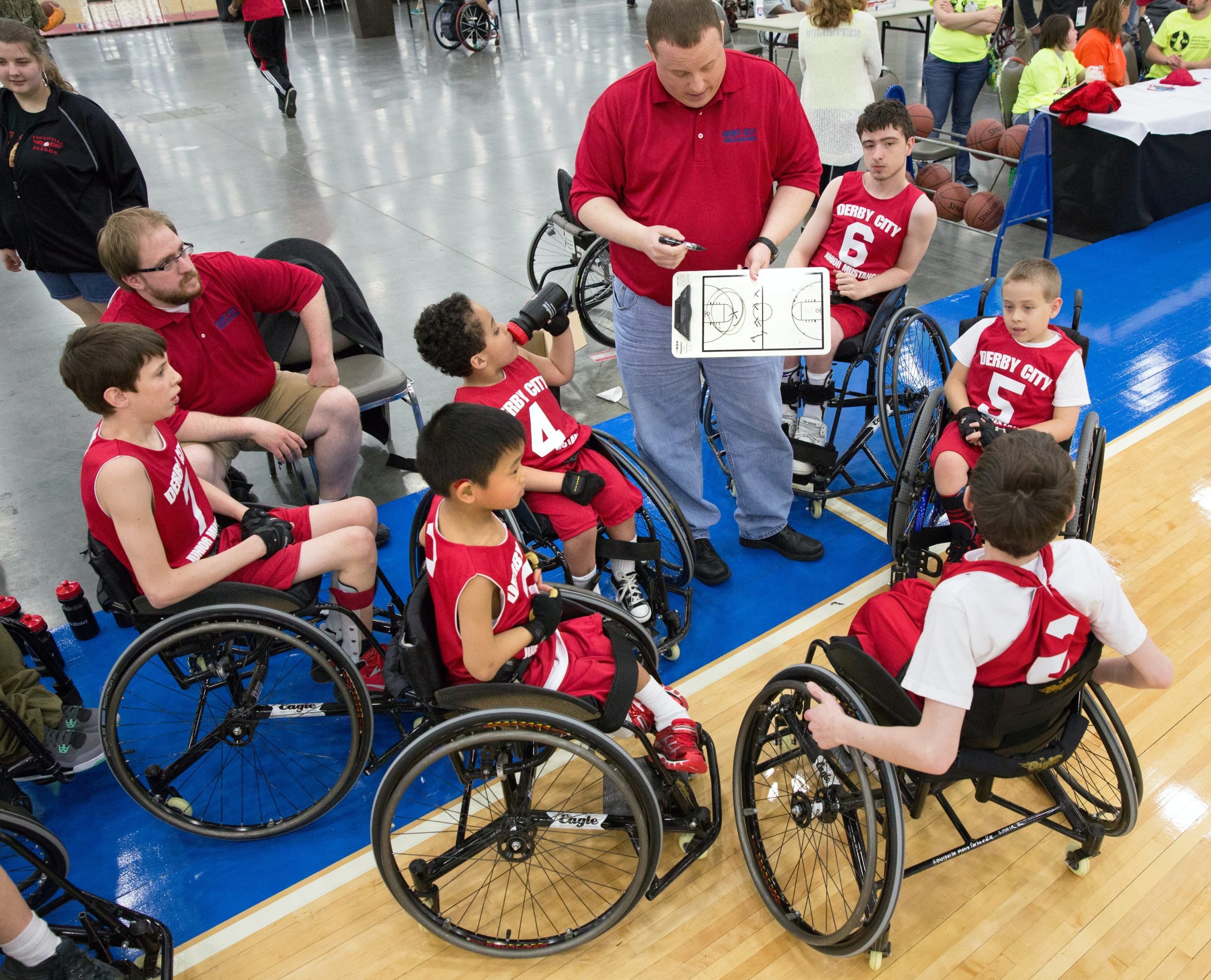 A team of young basketball players in wheelchairs.