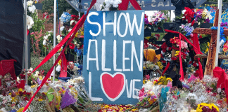 Allen Shooting Memorial sign reading "Show Allen Love."