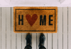 A doormat with the word "home" on it.