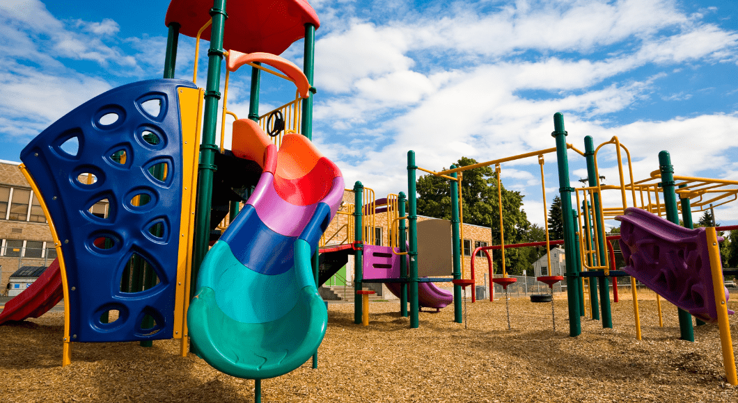 A colorful playground on a sunny, blue sky day.