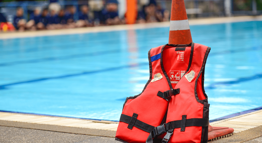Lifejacket next to a pool.