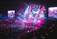 A concert with purple and teal lights.