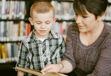 A mother reading with her son.