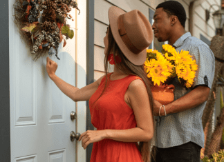 A woman knocks on the door and a man holds flowers.
