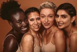 Skincare models with different skin tones.